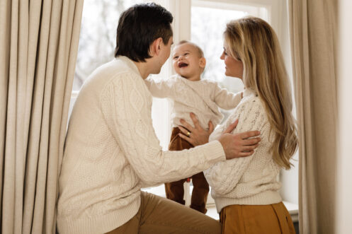 Young family in their Somerset home on a winter day.